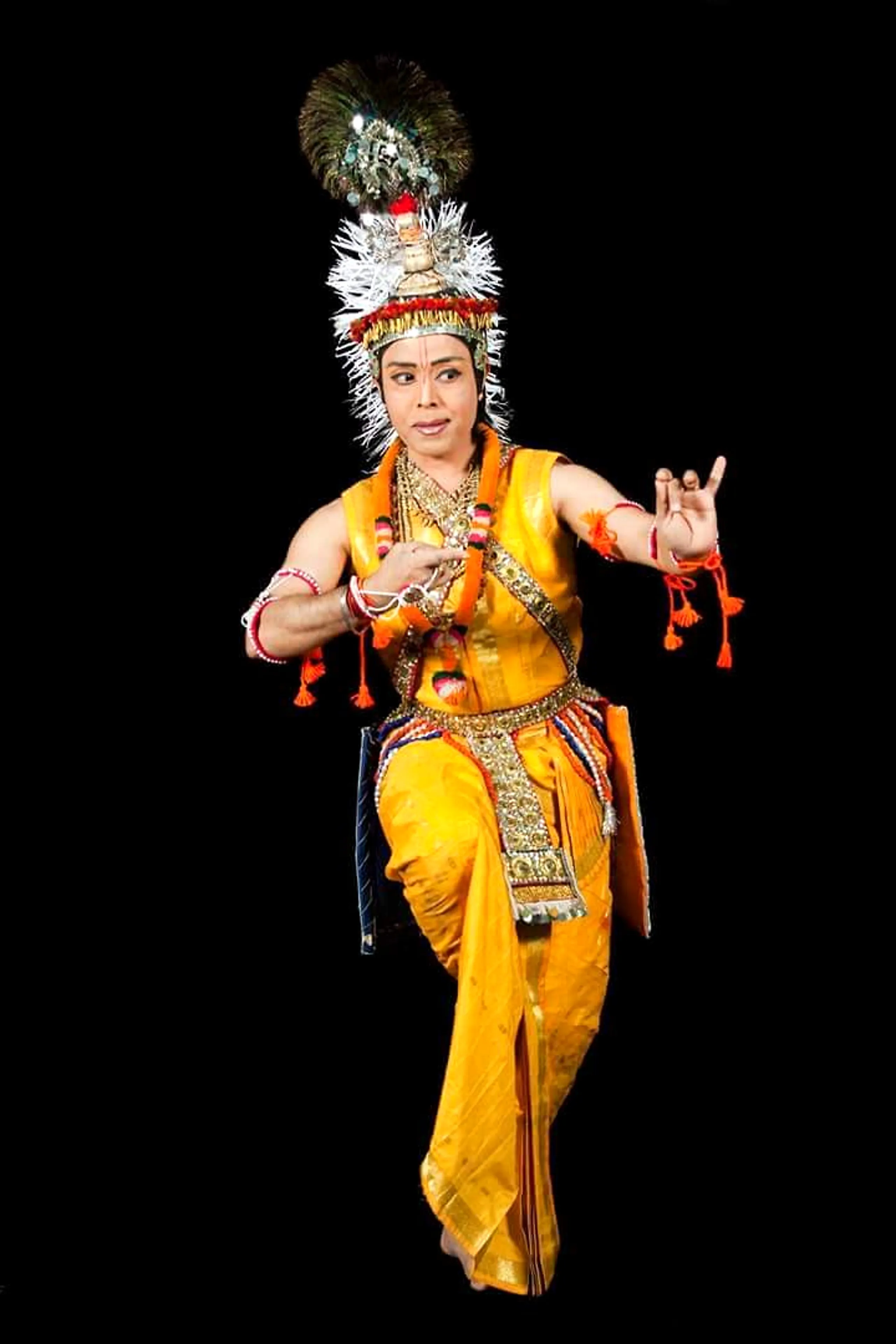 Sanjib in red Manipuri costume performing