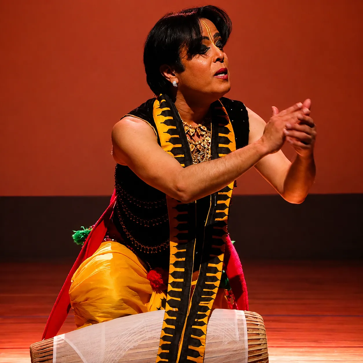 Sanjib demonstrating the pung, the Manipuri barrel drum
